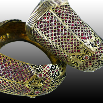 Pair of Minangkabau 12 ct. gold wedding armlets  or Gelang Gadang inset with ruby coloured stones