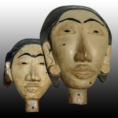 Bali male and female anamist head carvings