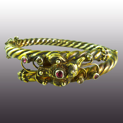Minangkabau twist style silver bracelet set with fine ruby coloured stones 