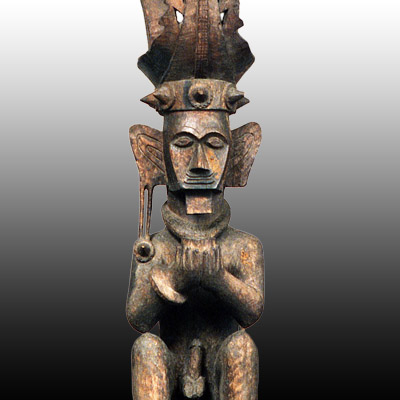 Nias Island male ancestor figure seated and holding a cup in both hands