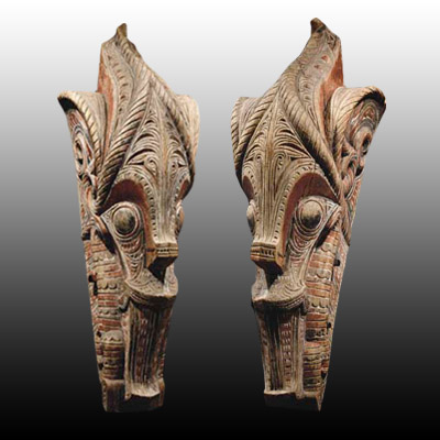 Large pair of Singa-Singa heads taken from a Batak Toba house gable