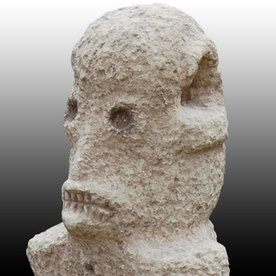Megalithic Sumba Island stone grave effigy or Penji with horrific skeletal gaze